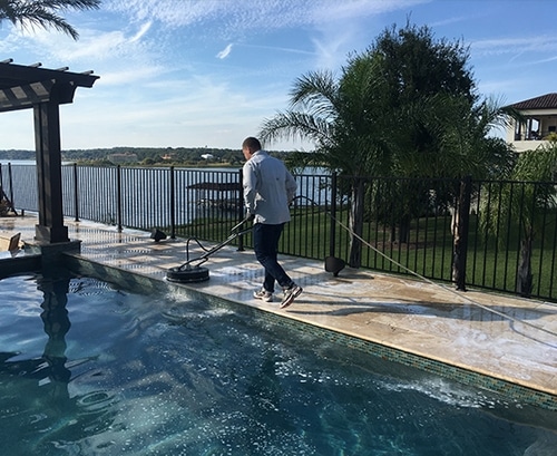 Pressure washing a paver walkway