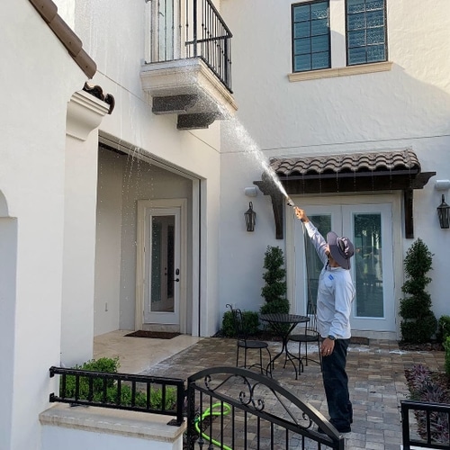 Soft washing a home entryway in Orlando